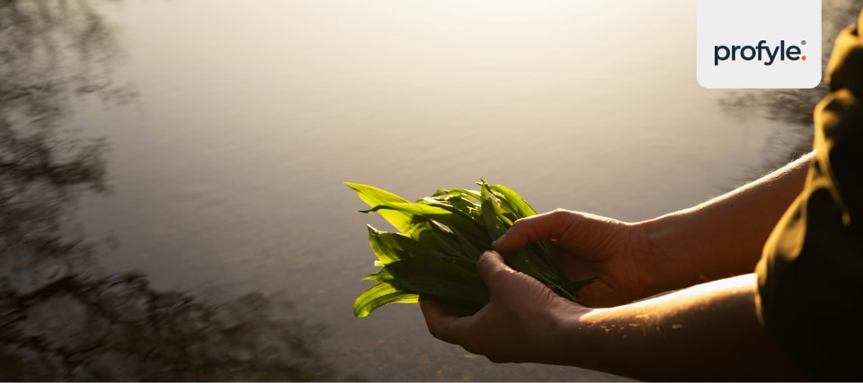 a woman holding leaves