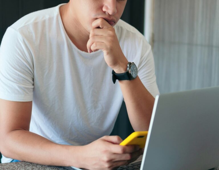 A businessman pondering the cost of digital business cards